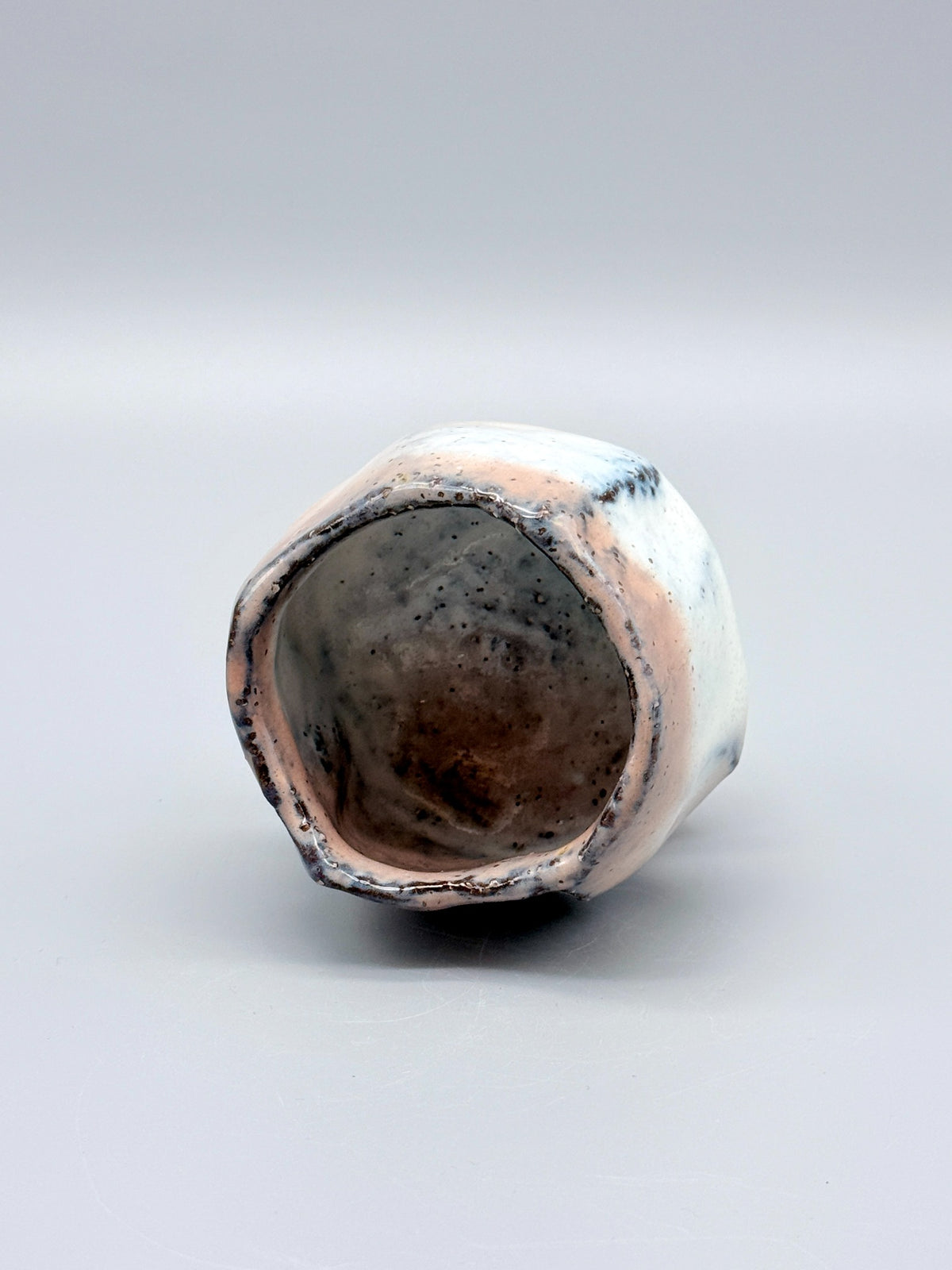 Top view of Kaneta Masanao footed cup, showing the irregular rim and glazed interior.