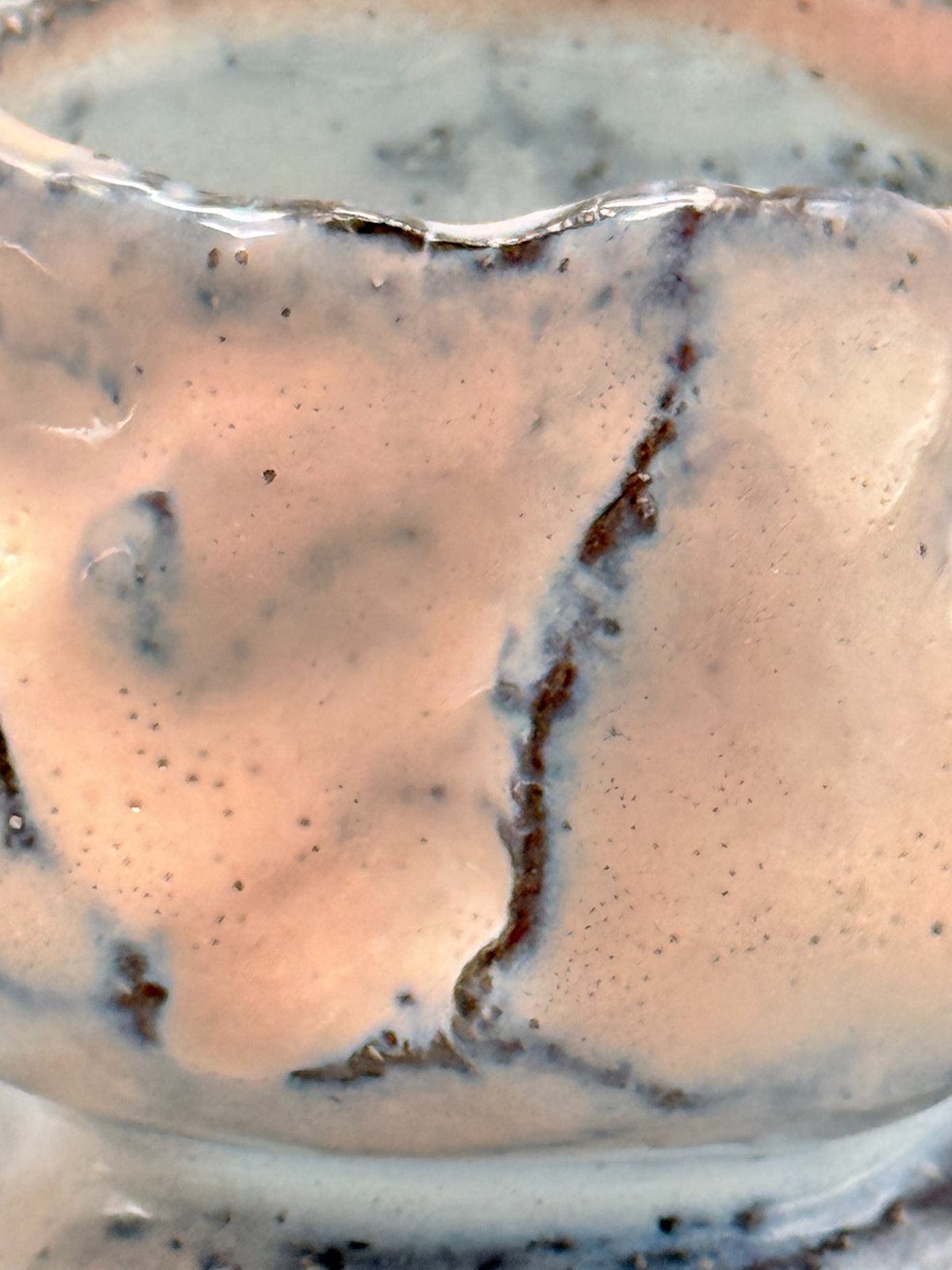 Detail of rose-blush glaze, pale blue-grey passages and dark brown lines on Kaneta Masanao footed cup.